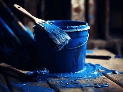 Blue Paint Bucket With Brush And Paint And Brushes