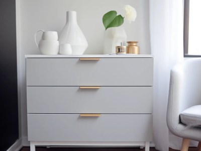 Large White Dresser With Gold Handles Sitting In Front Of A White Wall