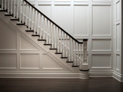 Room With A Staircase And A White Wood Wall